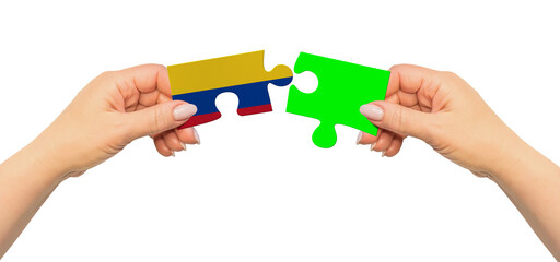 Woman hands are holding part of puzzle game. National mock up on white background. Colombia