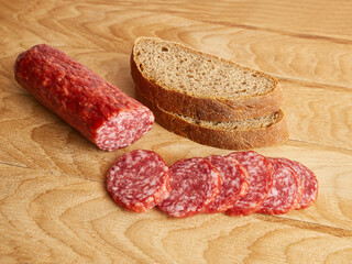 Making sandwiches from bread and sausage.