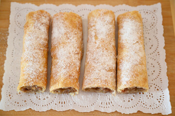 Iconic rustic Romanian and Moldavian pies with white sugar powder, sour cherry filing.