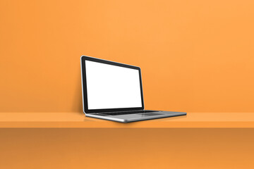Laptop computer on orange shelf background