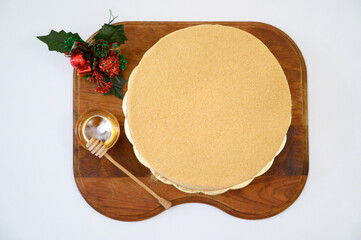 Russian cake Medovik with honey on a dark wooden board