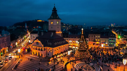 Fototapeta na wymiar Aerial drone view of The Council Square decorated for Christmas in Brasov, Romania