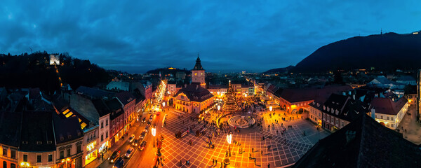 Aerial drone wide view of The Council Square decorated for Christmas in Brasov, Romania