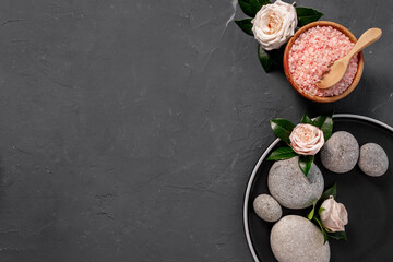 Spa stones for massage with roses and sea salt, top view