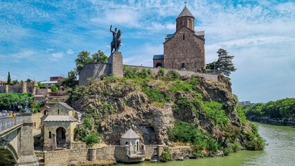Panoramic view on the Metekhi Church above the Kura river in city center of Tbilisi, Georgia. Georgian architecture sightseeing centre. Old town. Ancient church and cathedral view. © Chris