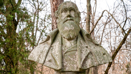 Fototapeta na wymiar Charles Darwin bust in a park in Bucharest, Romania