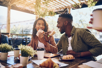 Theyre in the honeymoon stage of their relationship. Cropped shot of a happy young couple out for lunch at a cafe.