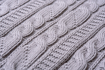 grey knitted plaid with patterned knitting
