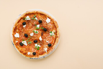 homemade pizza with tomatoes, olives and young cheese.