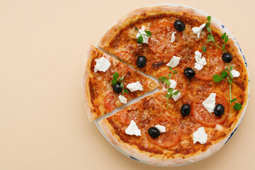 homemade pizza with tomatoes, olives and young cheese.