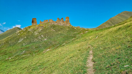 A hiking trail leading to the ruins of the Zakagori fortress in the Truso Valley near the Ketrisi Village Kazbegi District, Mtskheta-Mtianet in the Greater Caucasus Mountains, Georgia.Border to Russia