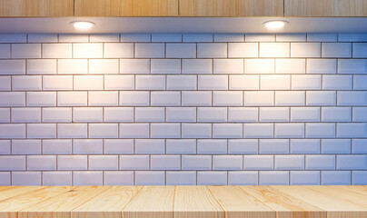 Front view of empty wood counter with lighting on white tiles wall and wooden countertop in modern kitchen room 