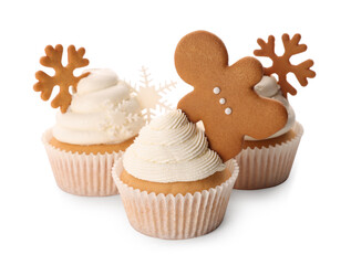 Tasty Christmas cupcakes with gingerbread man and snowflakes on white background