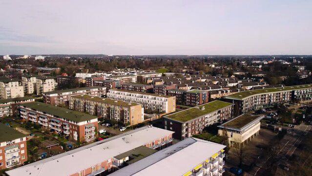 Aerial View of Suburban Apartment Houses with green roofs and Streets