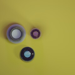 closeup of colorful glass vases on yellow table - 3d render - orthographic illustration