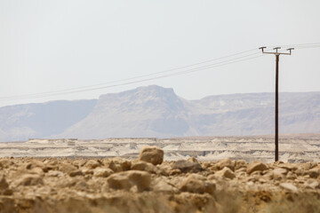 Rocky hills of the Negev Desert in Israel. Breathtaking landscape and nature of the Middle East at sunset. High quality photo