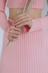 Fashion art details of fashion glamour clothes. Model posing isolated on white background