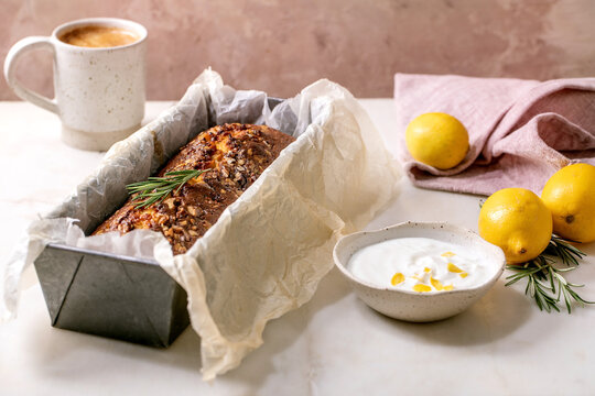 Homemade lemon cake with nuts and rosemary