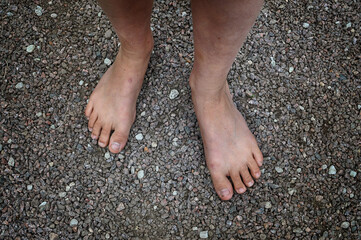 Bare feet in gravel