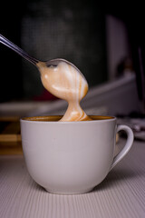 Cup of coffee with foamy milk. latte art. White mug. Breakfast

