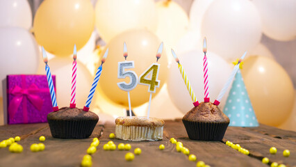 A beautiful birthday card for a woman with the number 54 in a cupcake against the background of...
