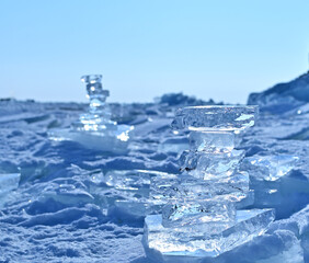 Fototapeta na wymiar Beautiful transparent blue ice blocks against the sky. Lake Baikal