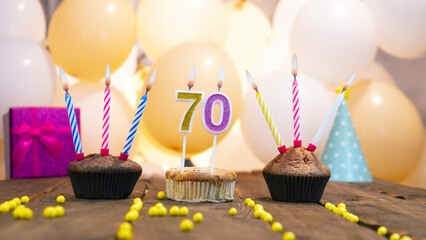 Beautiful birthday card for a woman with the number 70 in a cupcake against the background of...