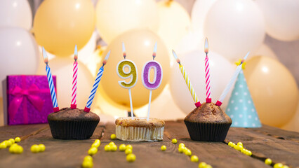 A beautiful birthday card for a woman with the number 90 in a cupcake against the background of...