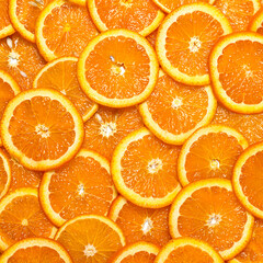 Photo of sliced tropical fresh colorful citrus fruits orange and red grapefruit in pattern flat lay creative modern style shot in studio