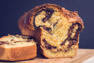Cozonac - Traditional Dessert in Romania, with: cacao, walnuts, milk, butter and sugar