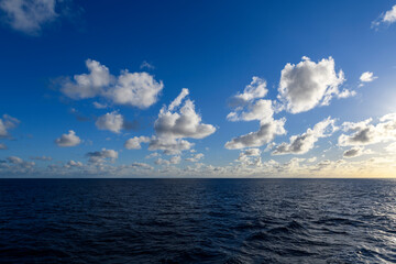 Seascape, blue sea. Sunset at sea. Calm weather. View from cargo vessel. Work at sea. Commercial...