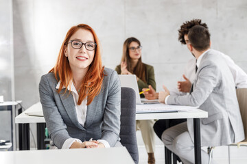 Corporate portrait of successful businesswoman at the office.	
