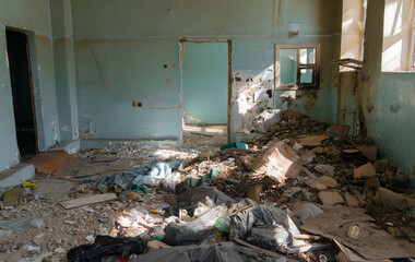 garbage on the floor of an abandoned room. trash in the building