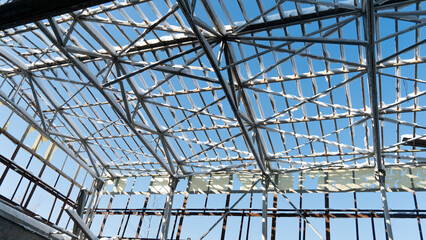 steel frame of a building covered with snow