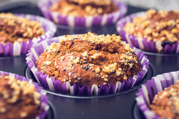 Delicious cupcakes with babanas and walnuts. (Closeup)
