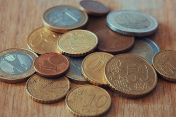A lot of euro cents of different denominations, a close-up shot.