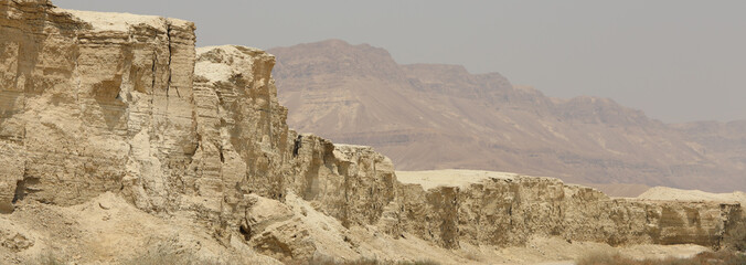 Rocky hills of the Negev Desert in Israel. Breathtaking landscape and nature of the Middle East at sunset. High quality photo