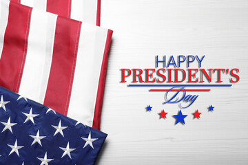 Fototapeta na wymiar Happy President's Day - federal holiday. American flag and text on white wooden background, top view