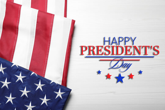 Happy President's Day - federal holiday. American flag and text on white wooden background, top view