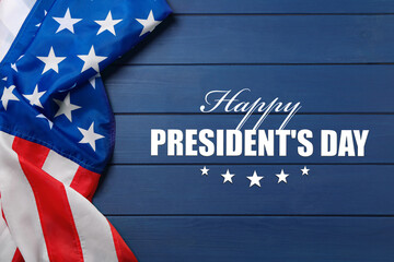 Fototapeta na wymiar Happy President's Day - federal holiday. American flag and text on blue wooden background, top view