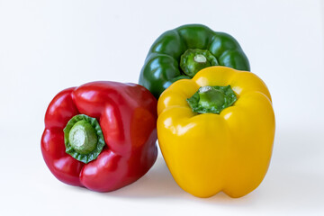 Closeup of colorful peppers, white background.