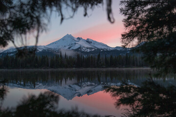 Sunrise at a high elevation lake with mountain scenery and reflections