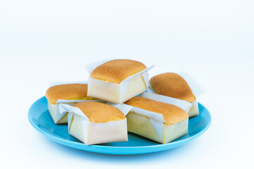 Handmade cupcakes on blue plate on white background. Pastry bakery on isolated background.