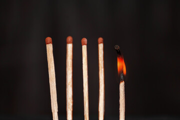 Five matches on a black background. Emotional or physical burnout of an employee at work. Loss of a member of the team. Loss of an ally.