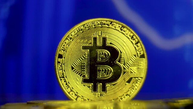 Golden bitcoin with moving collum line financial graph background. Crypto currency growth in e-commerce trading concept