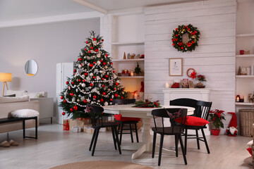 Cozy dining room interior with Christmas tree and festive decor
