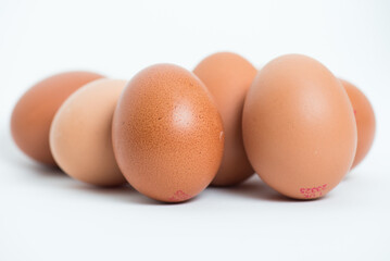 Raw eggs isolated on the white background.