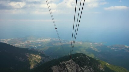 Mountain views from the cable car cabin to the top of Tahtali and the sea near the coast of Kemer Antalya Turkey