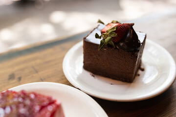 chocolate cake with strawberries and cheescake