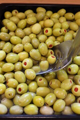 The olive, botanical name Olea europaea, meaning 'European olive', is a species of small tree or shrub in the family Oleaceae, found traditionally in the Mediterranean Basin. 